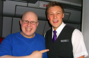 Adam with Matt Lucas on a VA flight